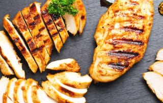 Juicy grilled chicken breasts with grill marks, ideal for restaurant and home cooking.