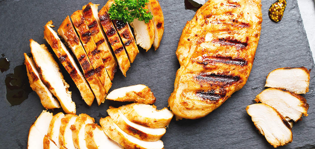 Juicy grilled chicken breasts with grill marks, ideal for restaurant and home cooking.