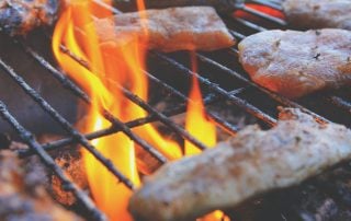 Grilling chicken on BBQ grill with flames, food preparation, outdoor cooking, Chef's Temp.