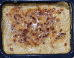 Creamy baked macaroni and cheese with crispy topping ready to serve.