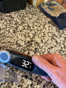 Digital food thermometer showing 32.1°F for meat temperature testing.