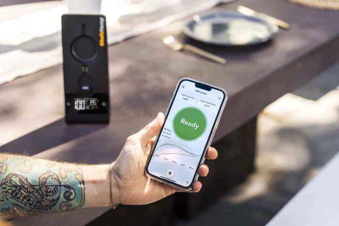 Wireless meat thermometer with smartphone app, cooking temperature monitoring tool, CookTemp smart device, digital culinary gauge.
