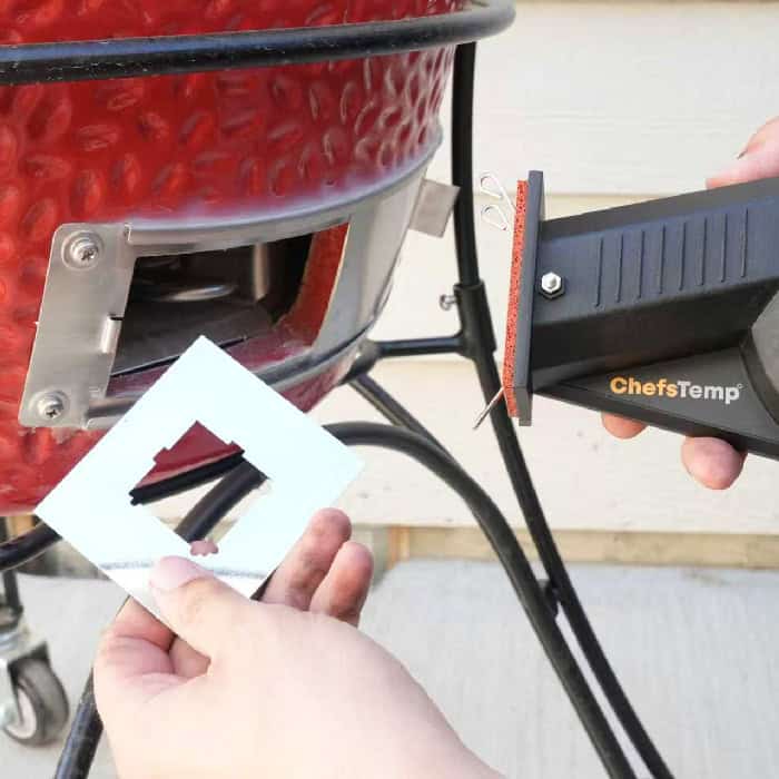 Thermometer for grill temperature measurement at outdoor BBQ grill.